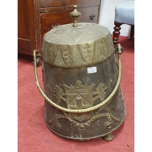 933 - A Copper and Brass Coal Bin with cast iron handle.
H 38 cm approx.