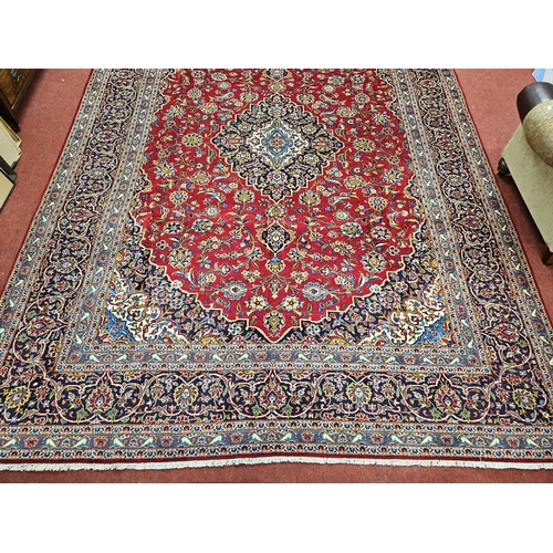 959 - Of Exceptional quality. A very fine hand woven full pile Persian Kashan Carpet with a traditional Ka... 