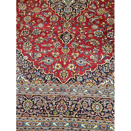 959 - Of Exceptional quality. A very fine hand woven full pile Persian Kashan Carpet with a traditional Ka... 