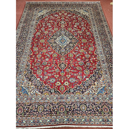 959 - Of Exceptional quality. A very fine hand woven full pile Persian Kashan Carpet with a traditional Ka... 