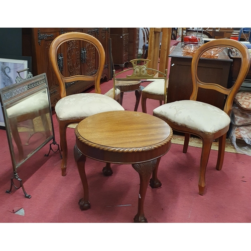 1028 - A late 19th Century Armchair along with a circular coffee table, two fire screens and two chairs.