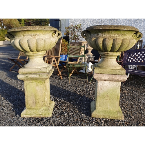 1065 - Two extremely large garden Urns on stands with twin lifting handles.
H 120 x  D 70 cm approx.