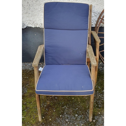 1070 - A pair of Teak garden Armchairs along with seat cushions.
 BH 100 x W 60 x D 60 cm approx.