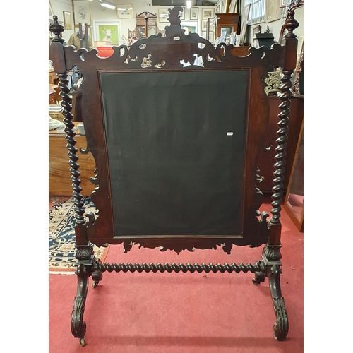 251 - An extremely large 19th Century solid Rosewood hearth Screen with profusely moulded outline on turne... 