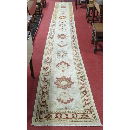 546 - A large long Afghan Cream Ground Runner with Beige ground multi borders and repeating central design... 