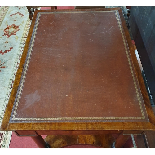 554 - A Regency Mahogany and Veneered Writing Table with brown tooled insert on pillared supports.
W1 106 ... 