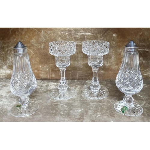 657 - A pair of Waterford Crystal Salts along with a pair of candlesticks.