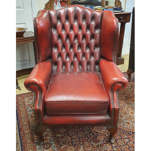 603 - A good burgundy ground Wingback Chair with deep buttoned back and cabriole supports. W 80 x SH 46 x ... 