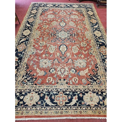 564 - A large Beige Ground Persian Carpet with unique centre medallion design and multi borders 436 cm x 3... 