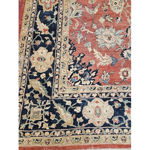 564 - A large Beige Ground Persian Carpet with unique centre medallion design and multi borders 436 cm x 3... 