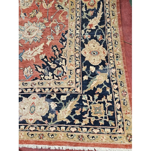 564 - A large Beige Ground Persian Carpet with unique centre medallion design and multi borders 436 cm x 3... 