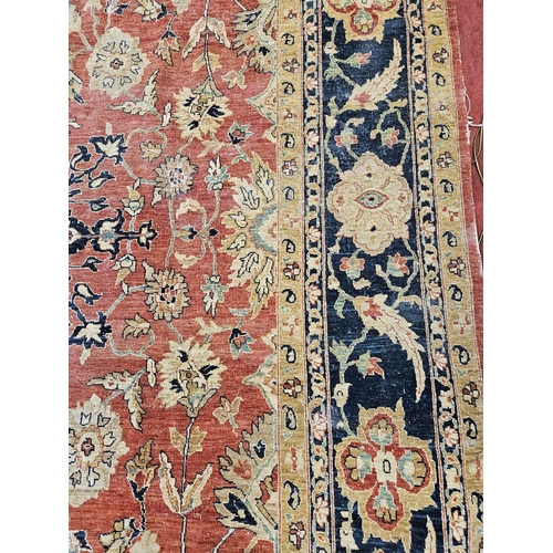 564 - A large Beige Ground Persian Carpet with unique centre medallion design and multi borders 436 cm x 3... 