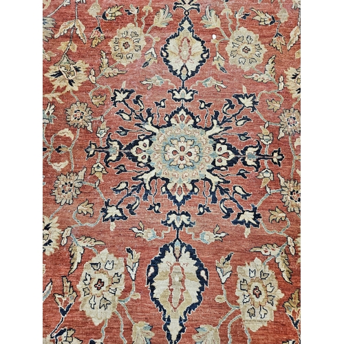 564 - A large Beige Ground Persian Carpet with unique centre medallion design and multi borders 436 cm x 3... 