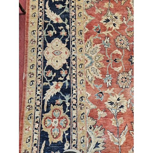 564 - A large Beige Ground Persian Carpet with unique centre medallion design and multi borders 436 cm x 3... 