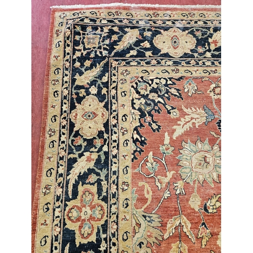 564 - A large Beige Ground Persian Carpet with unique centre medallion design and multi borders 436 cm x 3... 