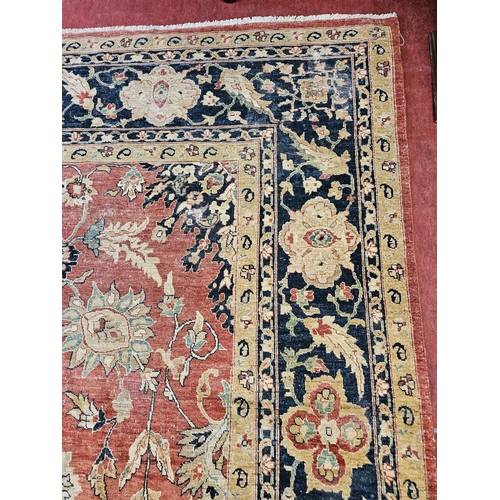 564 - A large Beige Ground Persian Carpet with unique centre medallion design and multi borders 436 cm x 3... 