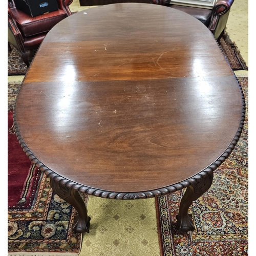 589 - An early 20th Century Mahogany Dining Table of neat proportions with rope edge outline and carved ba... 