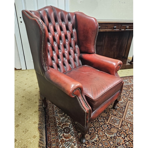 603 - A good burgundy ground Wingback Chair with deep buttoned back and cabriole supports. W 80 x SH 46 x ... 