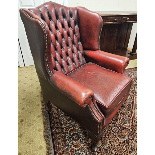 603 - A good burgundy ground Wingback Chair with deep buttoned back and cabriole supports. W 80 x SH 46 x ... 