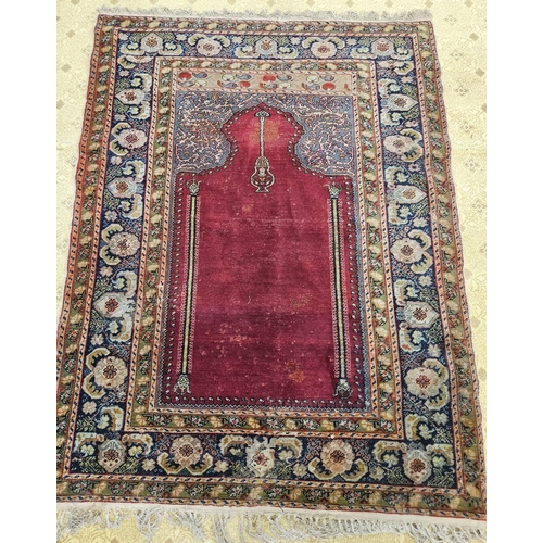 604 - A burgundy ground Persian Rug 197 x 140cm approx.