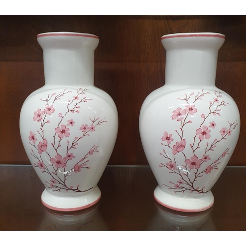 1304 - A pair of Cream ground Vases. H 22 cm approx.