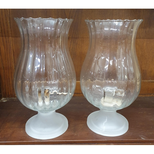 1306 - Two Glass Candle holders. H 26 cm approx.