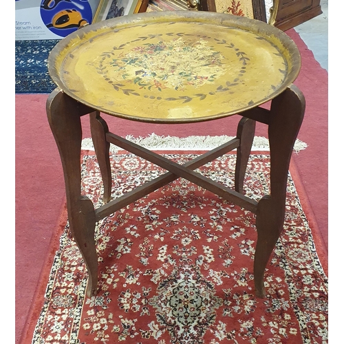 1307 - An early 20th Century tray top Foldup Table with two painted decorated trays. D 44 cm approx.