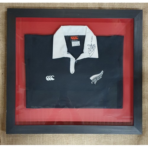 A signed Canterbury New Zealand All Blacks Jersey. Signed by Jonah Lomu on the collar. Provenance-In 2001 the vendor was the president of the Clonmel Lions club and Jonah Lomu was promoting Bulmers at the time in Clonmel and he signed two rugby shirts which were put into a charity auction. The vendor bought one and a friend bought the other.