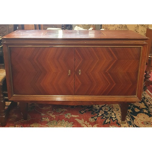 562A - A Superb Art Deco style Rosewood two door Cabinet with brass banded outline on simple tapered legs. ... 