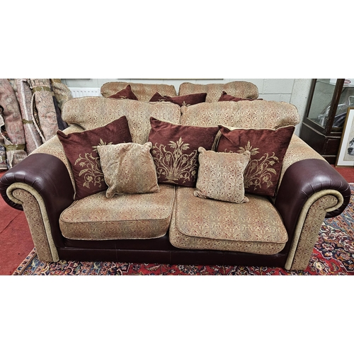 1414 - A burgundy and cream ground Couch with leather arm savers and a large quantity of dab cushions.
SH 4... 