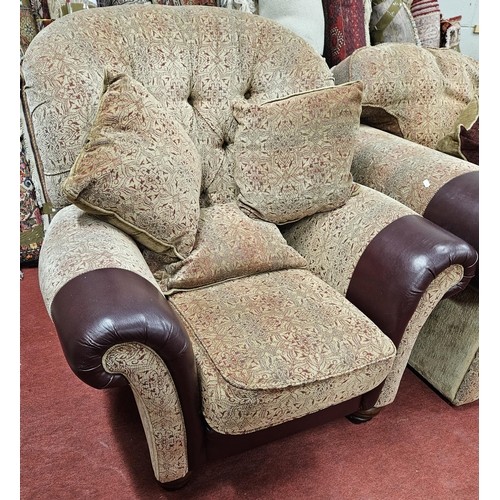 1414 - A burgundy and cream ground Couch with leather arm savers and a large quantity of dab cushions.
SH 4... 