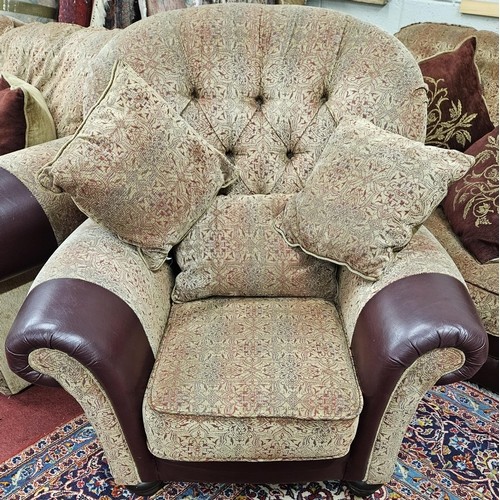 1414 - A burgundy and cream ground Couch with leather arm savers and a large quantity of dab cushions.
SH 4... 