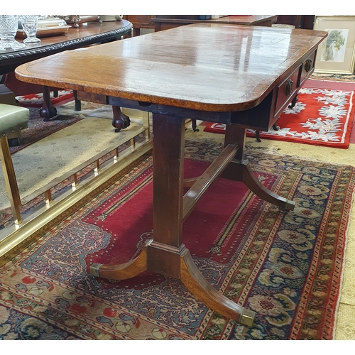 605 - A 19th Century Mahogany and Veneered Sofa Table of neat proportions with twin frieze drawers on spla... 