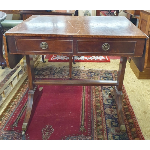 605 - A 19th Century Mahogany and Veneered Sofa Table of neat proportions with twin frieze drawers on spla... 