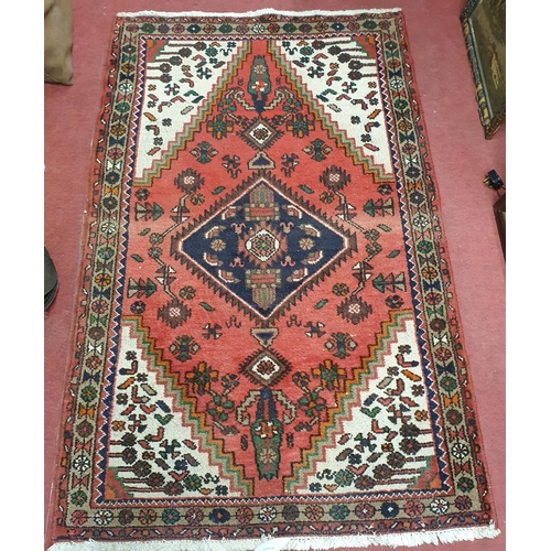 1278 - A good Persian red ground carpet with multi borders and unique central medallion design.
163 x 103 c... 