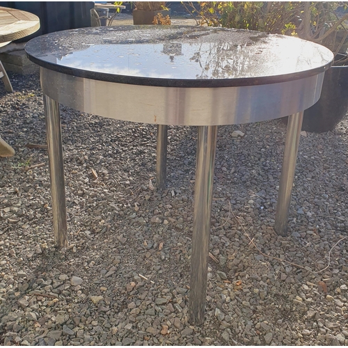 1401 - A Stainless Steel circular Table with Black Stone top along with a cast Iron pub style Table.
 H 78 ... 