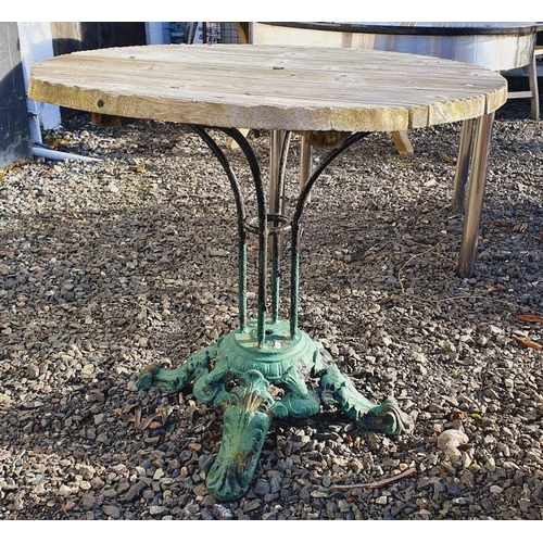 1401 - A Stainless Steel circular Table with Black Stone top along with a cast Iron pub style Table.
 H 78 ... 