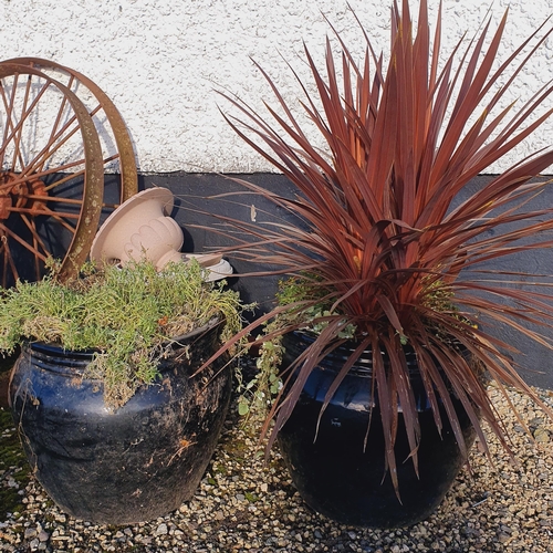 1405 - A pair of Black Ceramic Pots.
 H 42 x D 47 cm approx.