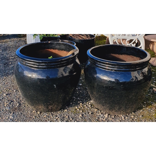 1406 - A pair of Black Ceramic Pots.
 H 44 x D 48 cm approx.