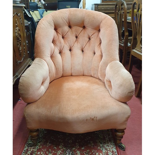 1423 - A 19th Century deep buttoned tub Armchair with pink draylon and dab buttoned back on turned supports... 