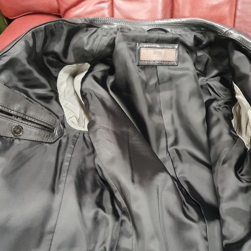 153 - A Hugo Boss Men's Jacket. Black Leather, size 50.
Pre-owned, excellent condition, Retails at €500 .