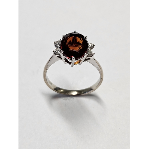 333 - A 14ct Gold, Diamond and Garnet Ring, size P.