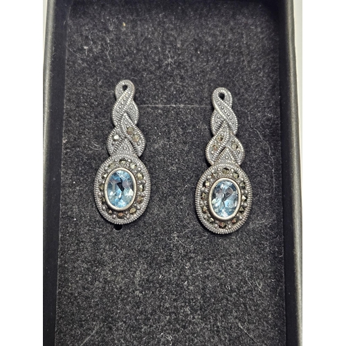 311 - A pair of Silver, Topaz and Marcasite drop Earrings.