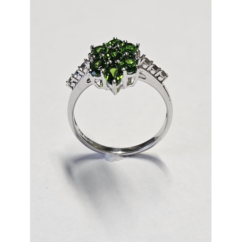 348 - A Silver and gem set cluster Ring, size N1/2.