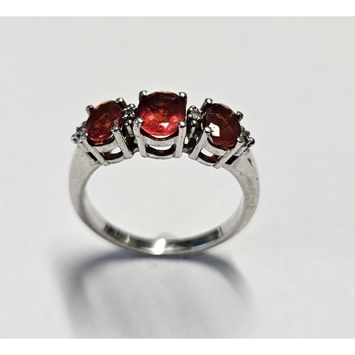 361 - A Silver and Garnet Ring, size O.