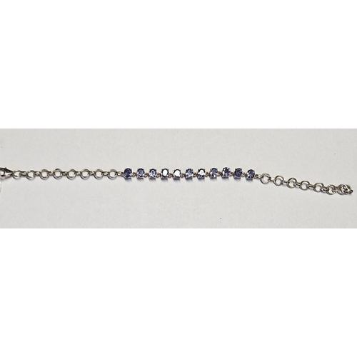 373 - A Silver and gen set Bracelet.