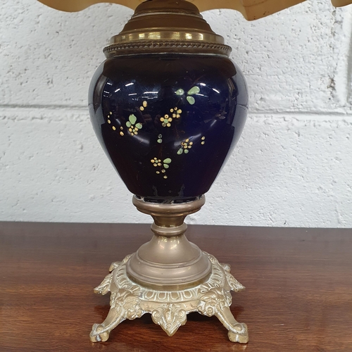 11 - Of Fabulous quality a Ceramic and Brass Lamp with needlework Shade. 47 x 32 cm approx.