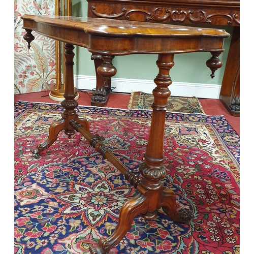 700 - A 19th Century Mahogany Library Table of small proportions on turned carved and splayed supports and... 