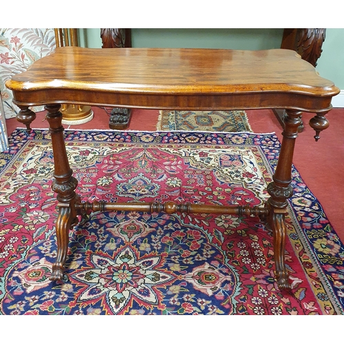 700 - A 19th Century Mahogany Library Table of small proportions on turned carved and splayed supports and... 