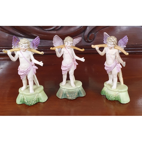 769 - Three German figures of Cherubs along with a group of decorative figures of Women.
H 22 cm approx.